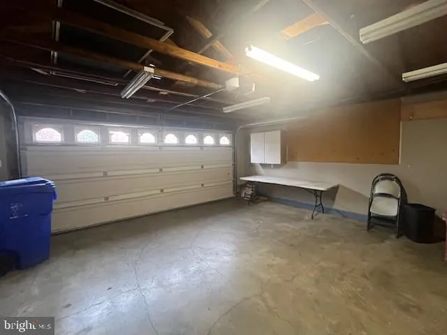 a view of backyard with a garden and trees