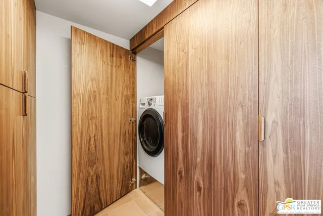a view of a hallway with washer and dryer