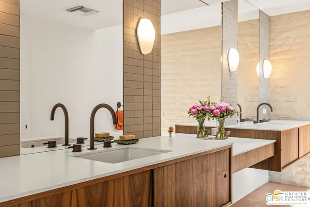 a kitchen with a sink and a large window