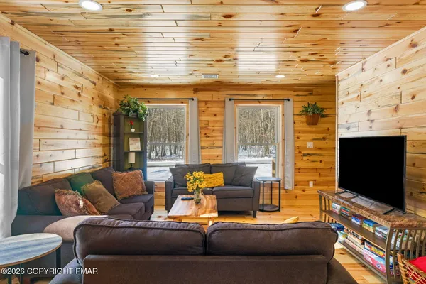 a kitchen with stainless steel appliances granite countertop a sink a stove cabinets and a refrigerator