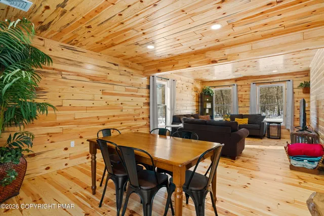 a kitchen with stainless steel appliances granite countertop a sink a stove and refrigerator