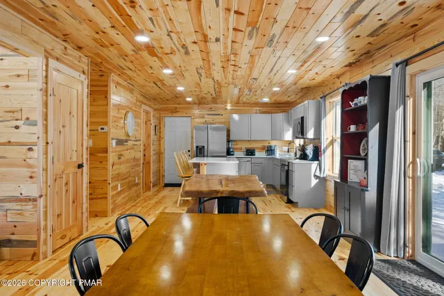 a kitchen with stainless steel appliances a sink stove and microwave