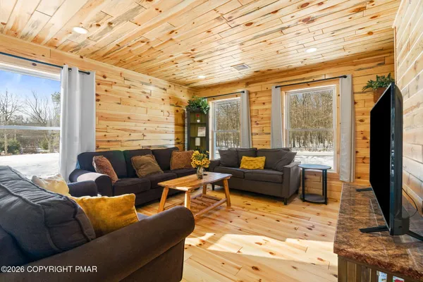 a kitchen with stainless steel appliances granite countertop a sink a stove and a microwave