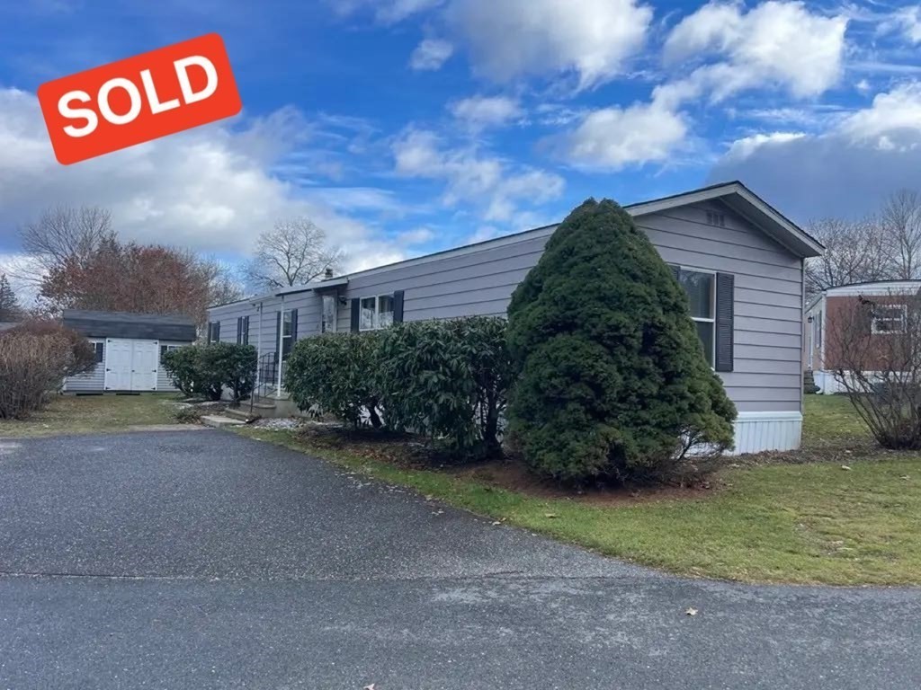 a view of a street with front of a house
