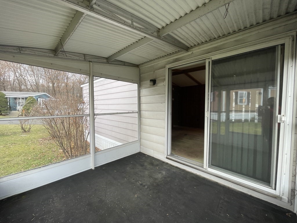 239 Ayer Road, Unit 49 Littleton, MA 01460 - Photo 11 of 21 a view of an empty room with a fireplace