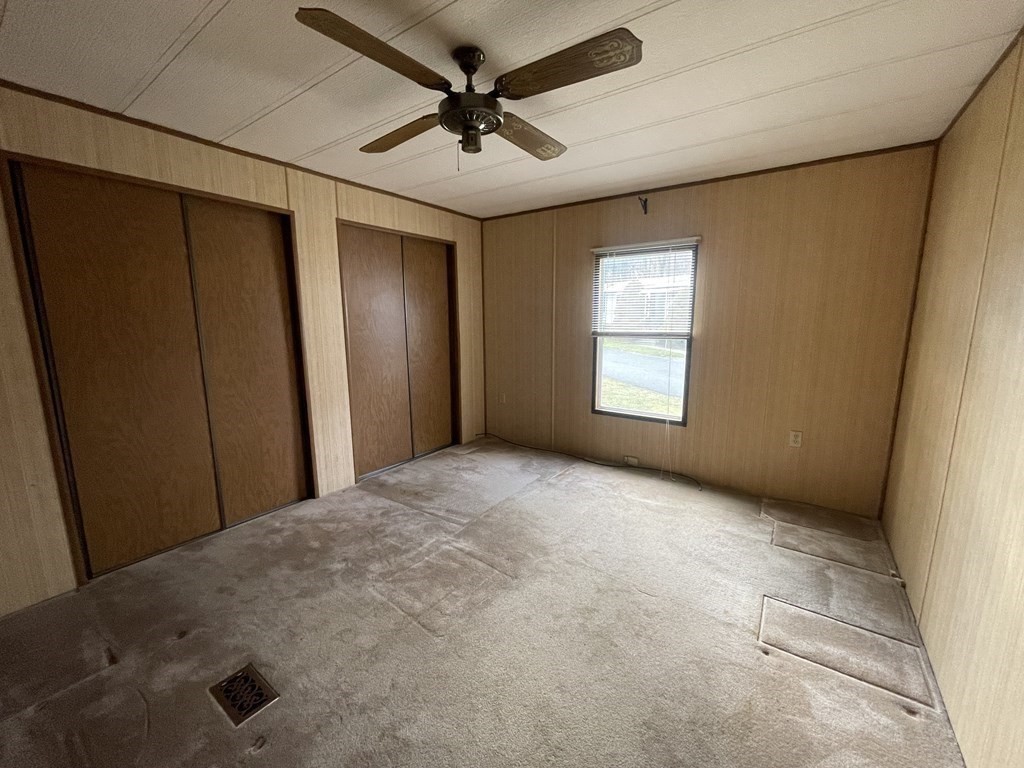 239 Ayer Road, Unit 49 Littleton, MA 01460 - Photo 15 of 21 a view of a livingroom with a ceiling fan and window