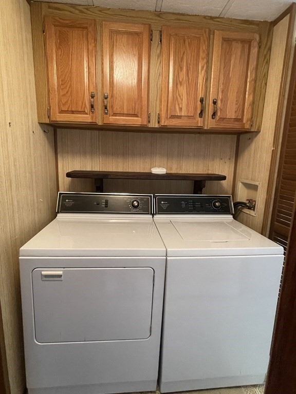 239 Ayer Road, Unit 49 Littleton, MA 01460 - Photo 16 of 21 a utility room with dryer and washer