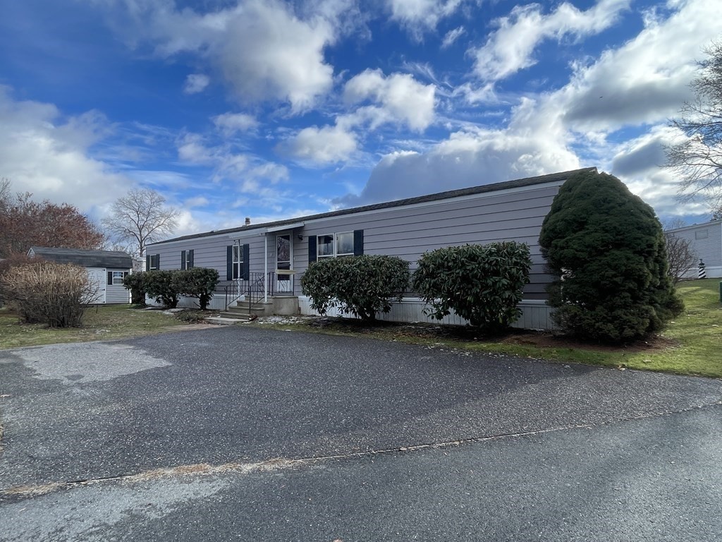 239 Ayer Road, Unit 49 Littleton, MA 01460 - Photo 20 of 21 a cars parked in front of a house