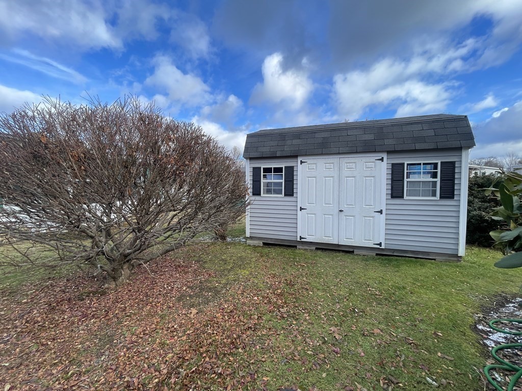 239 Ayer Road, Unit 49 Littleton, MA 01460 - Photo 21 of 21 a view of a house with a yard