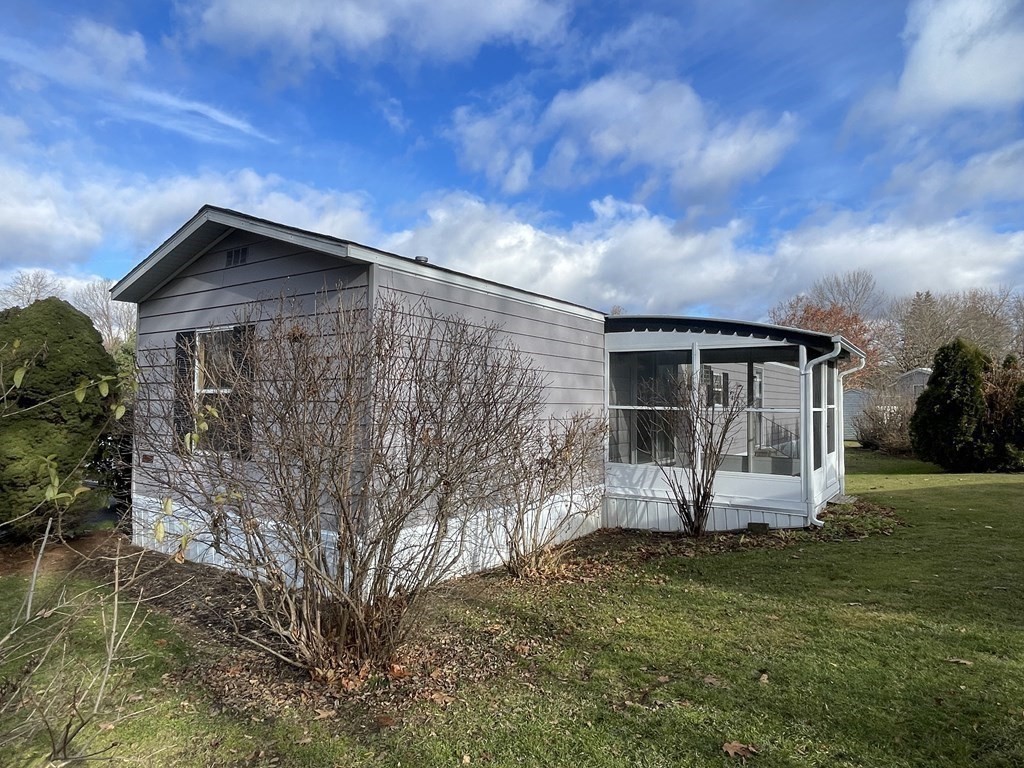 239 Ayer Road, Unit 49 Littleton, MA 01460 - Photo 3 of 21 a front view of house with yard