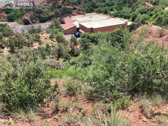 an aerial view of a house with yard and outdoor seating