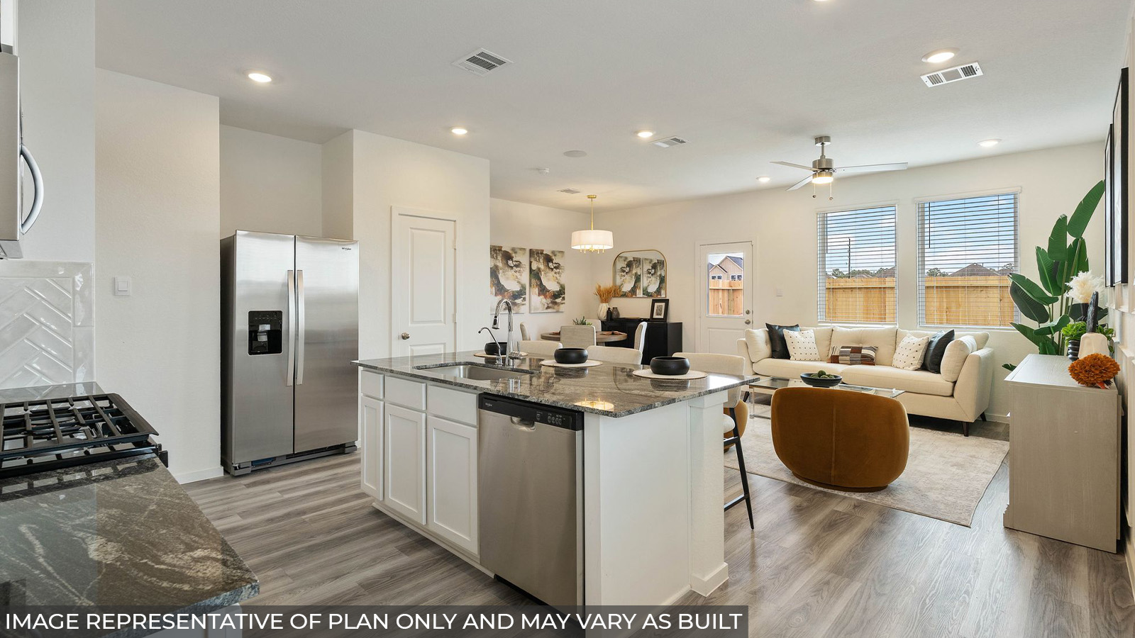 232 Flying Tigers Trail Jarrell, TX 76537 - Photo 5 of 22 a open kitchen with stainless steel appliances granite countertop a stove refrigerator and cabinets