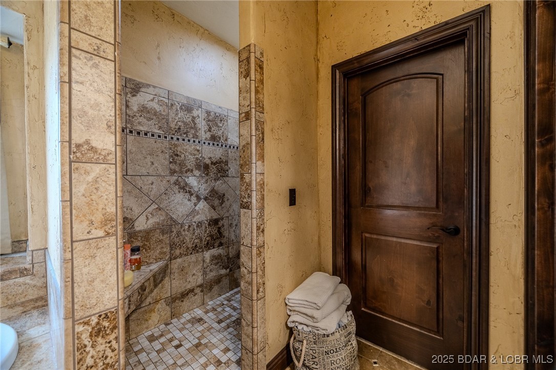 50 Go Ye Ranch Road Brumley, MO 65017 - Photo 21 of 45 Elegant walk-in shower with a seamless, door-free