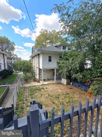 a view of a car parked in front of a house