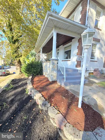 a kitchen with stainless steel appliances wooden floors and wooden cabinets