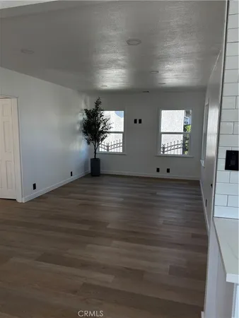 a kitchen with cabinets stove and a sink