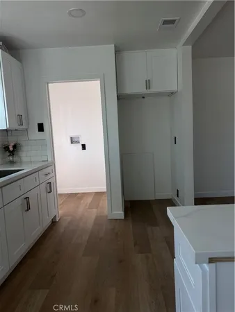 a spacious bathroom with a granite countertop sink mirror and toilet