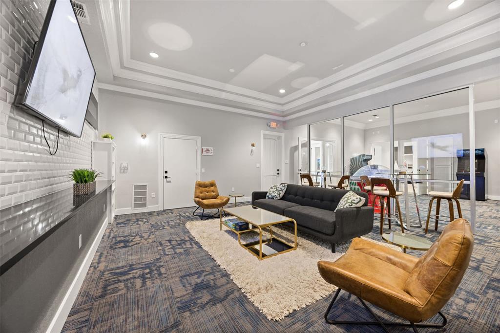 9009 North FM 620, Unit 702 Austin, TX 78726 - Photo 13 of 19 a living room with furniture wooden floor and a rug