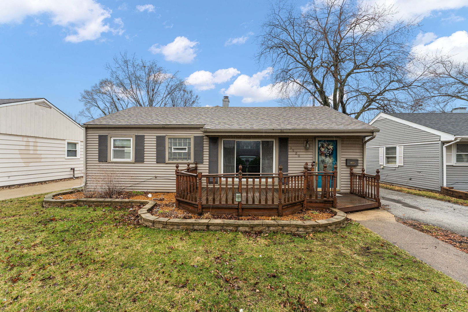 a front view of a house with yard porch and outdoor seating