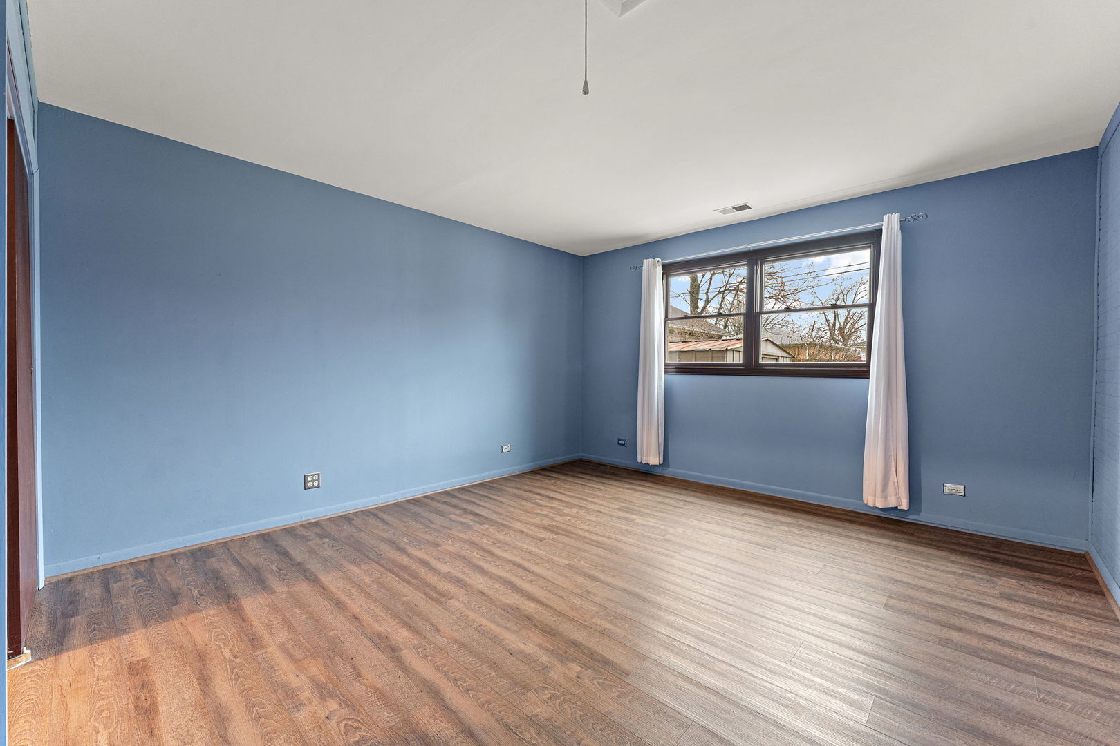 3520 Jackson Street Lansing, IL 60438 - Photo 15 of 22 an empty room with wooden floor and windows