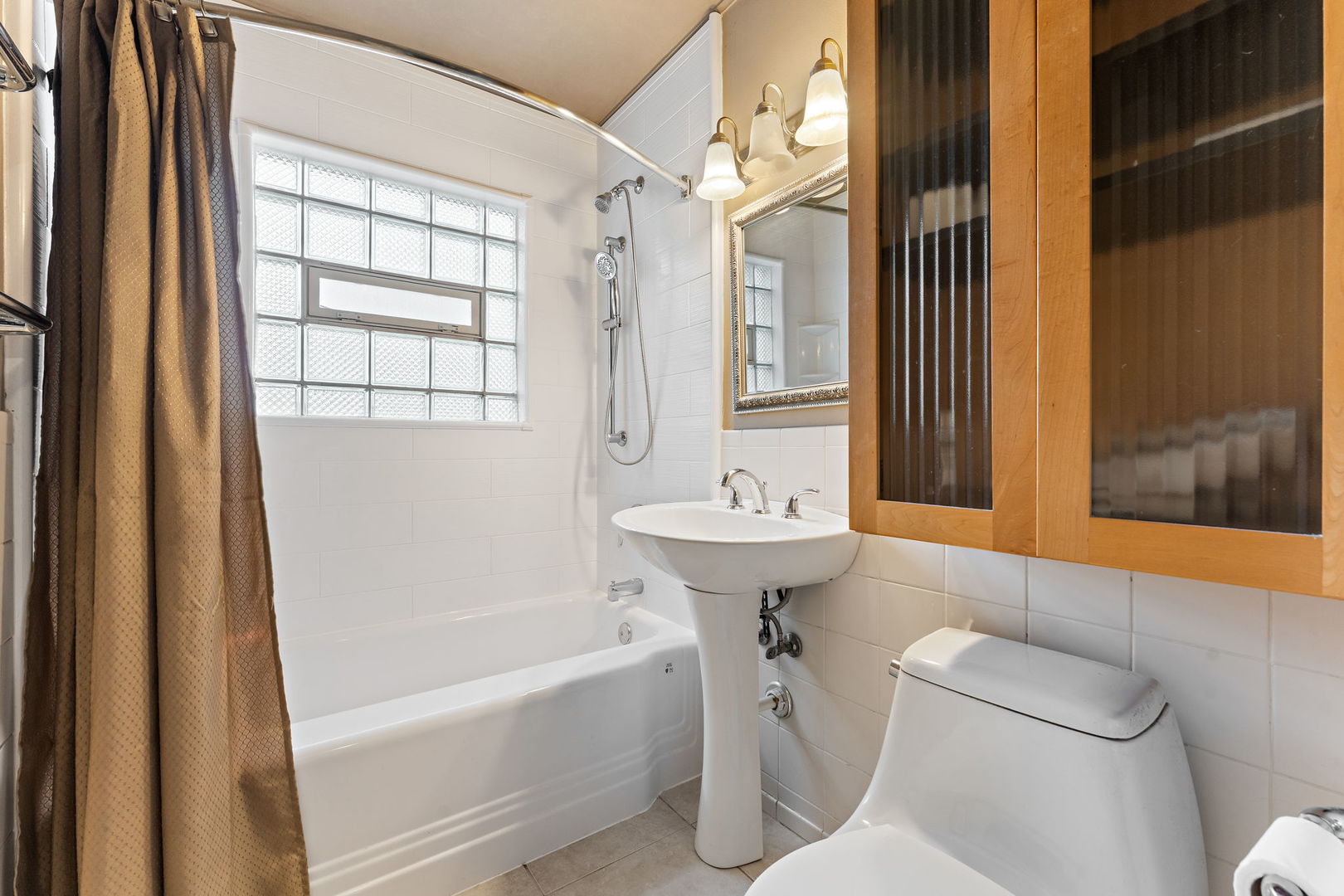 3520 Jackson Street Lansing, IL 60438 - Photo 19 of 22 a bathroom with a sink toilet and shower
