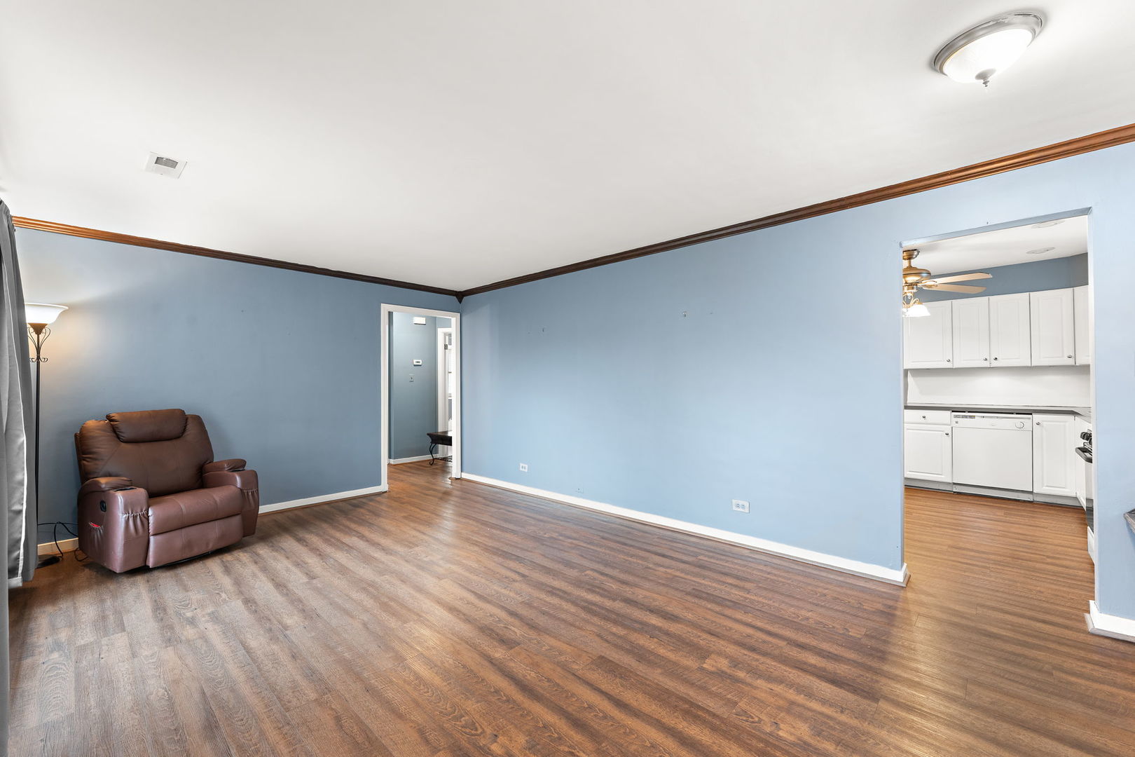 3520 Jackson Street Lansing, IL 60438 - Photo 4 of 22 wooden floor in an empty room with a window
