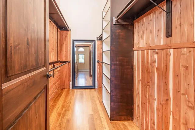 a view of a balcony with wooden floor and door