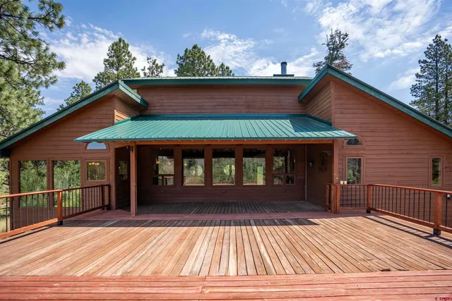 a view of a patio with a table and chairs