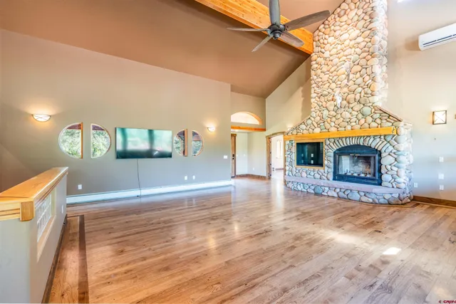 a view of a living room and a fireplace