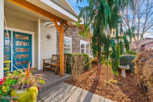 a view of a patio with table and chairs and potted plants