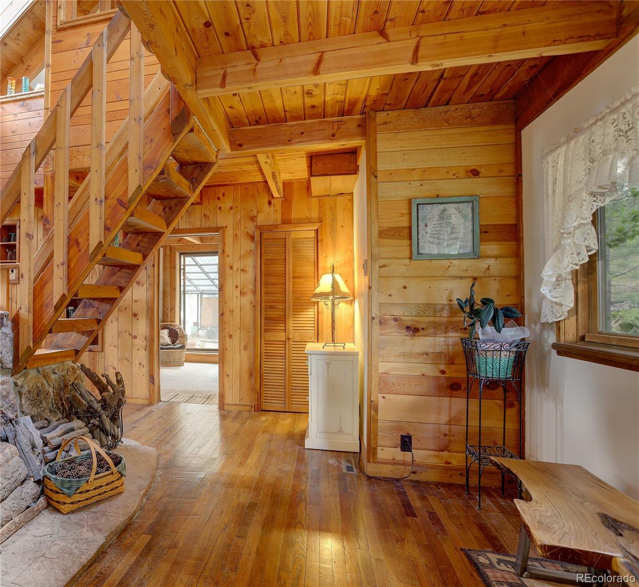 77 East Crosscut Road Bailey, CO 80421 - Photo 11 of 43 a view of entryway with wooden floor