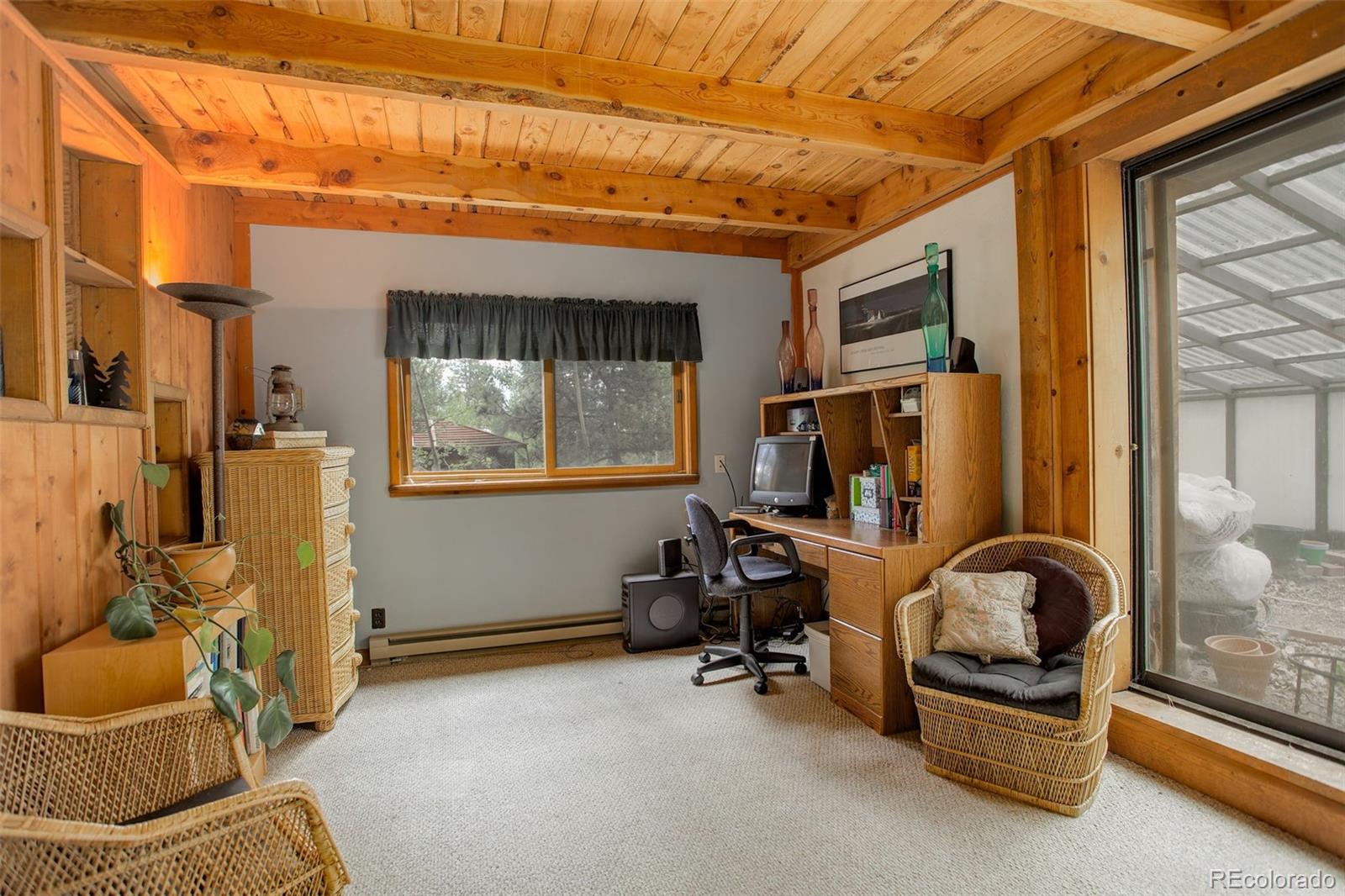 77 East Crosscut Road Bailey, CO 80421 - Photo 12 of 43 a room with furniture and a window