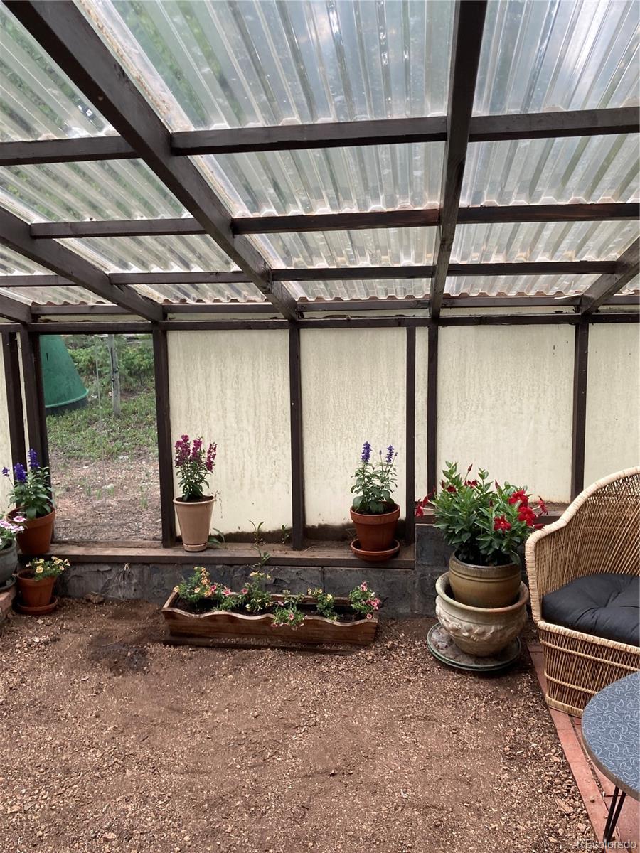 77 East Crosscut Road Bailey, CO 80421 - Photo 17 of 43 a room with gym equipment and a large window