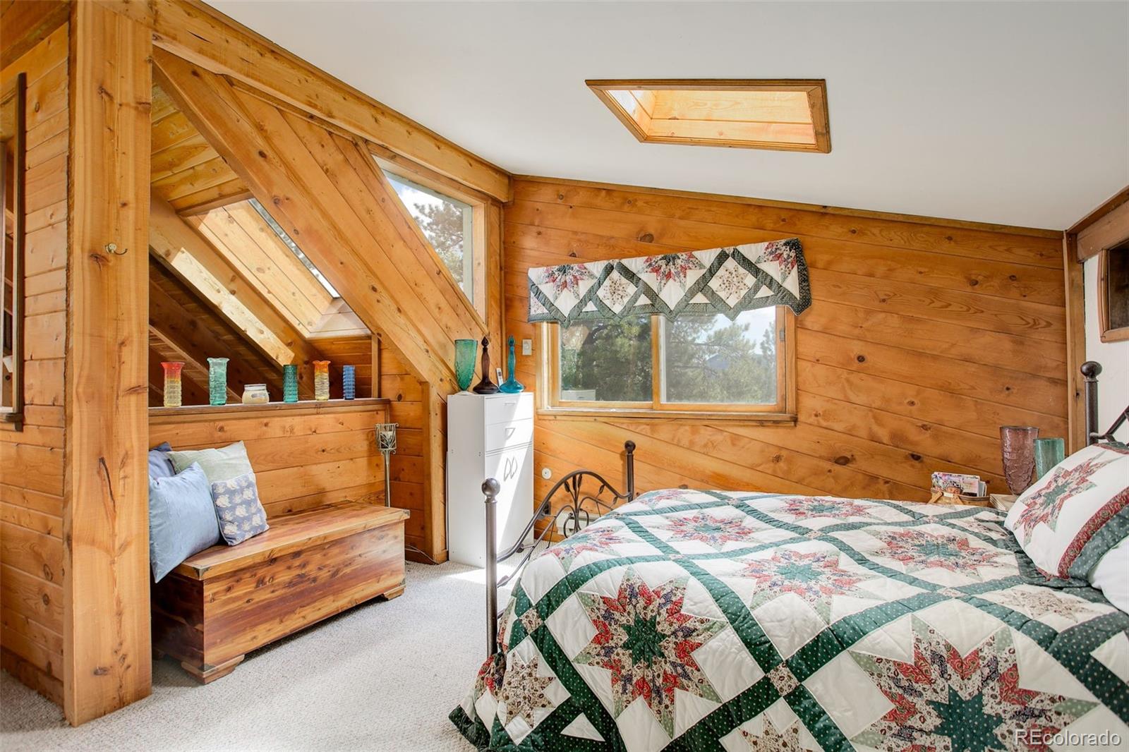 77 East Crosscut Road Bailey, CO 80421 - Photo 33 of 43 a bedroom with a bed and a window