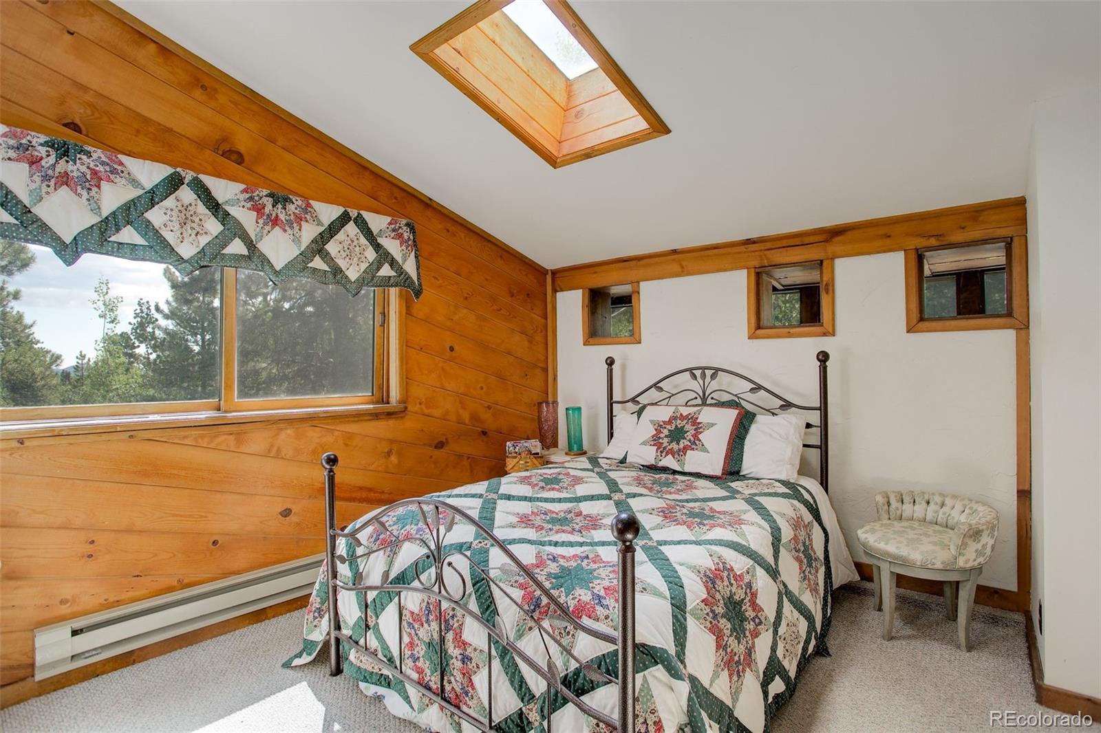 77 East Crosscut Road Bailey, CO 80421 - Photo 34 of 43 a bedroom with a bed and window