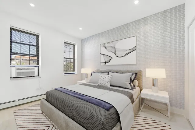 a bedroom with bed and window