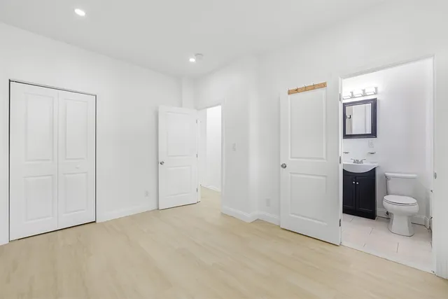 a view of a storage & utility room with closet window