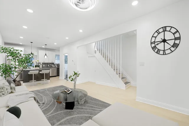 a living room with furniture and white walls