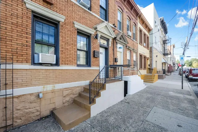 a view of a building with a street
