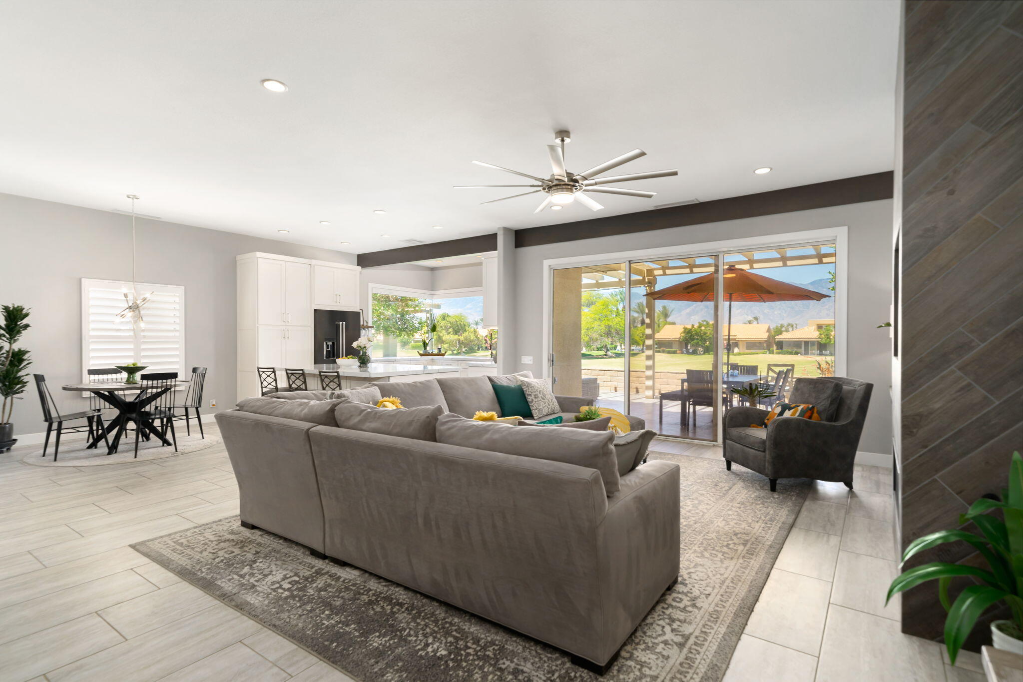 93 Augusta Drive Rancho Mirage, CA 92270 - Photo 12 of 39 a living room with furniture and a large window