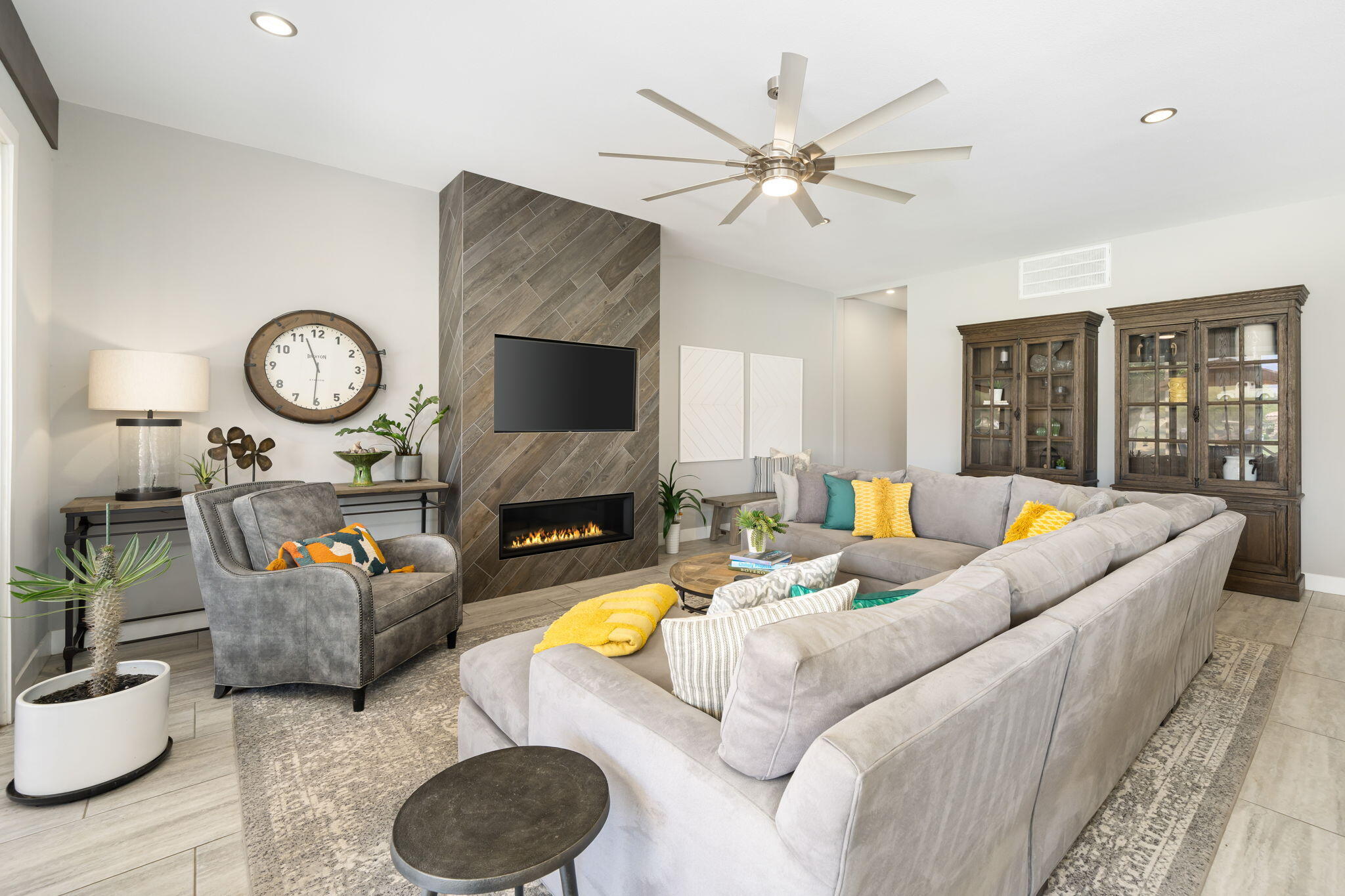 93 Augusta Drive Rancho Mirage, CA 92270 - Photo 14 of 39 a living room with furniture a fireplace and a flat screen tv