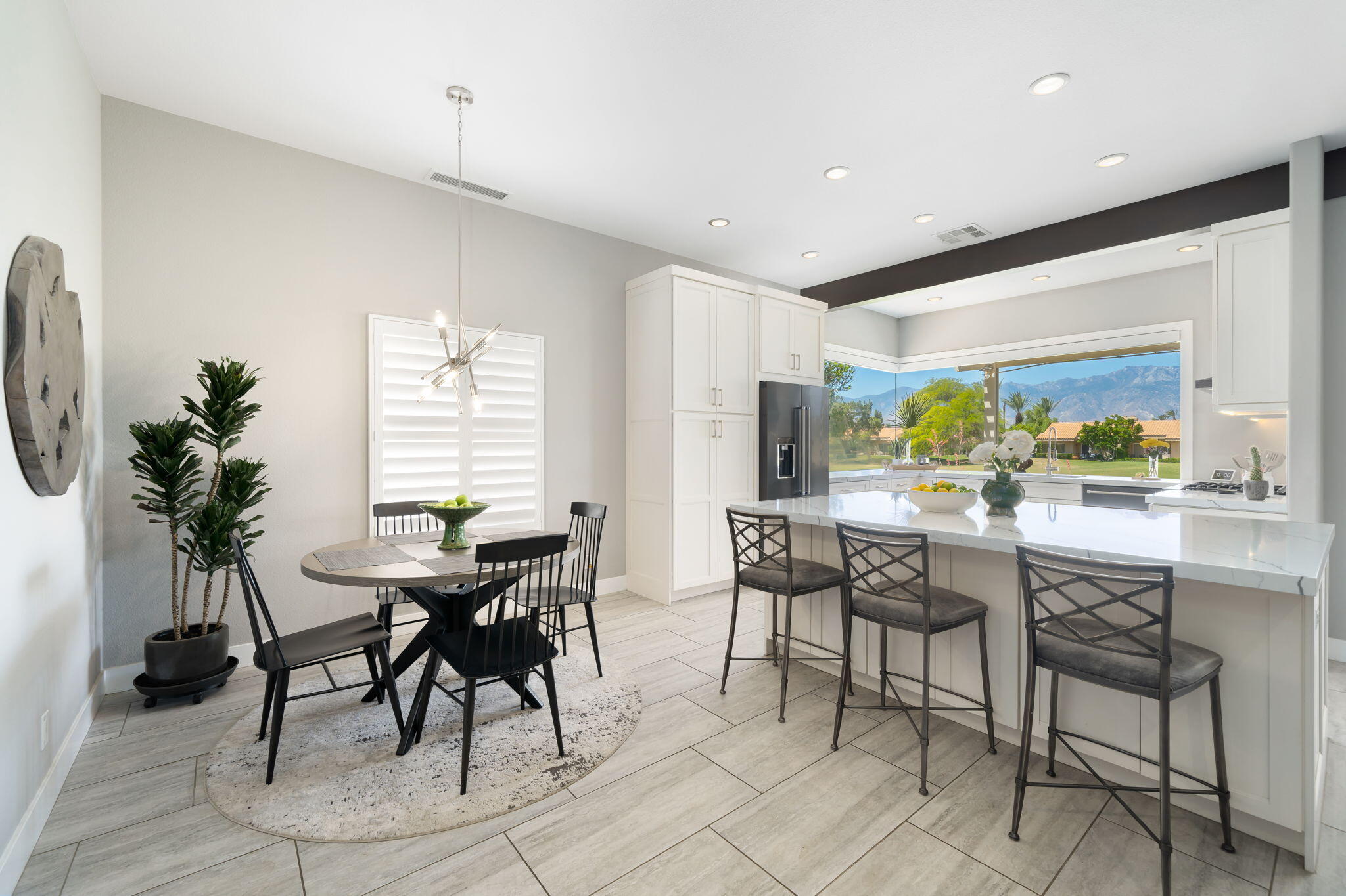 93 Augusta Drive Rancho Mirage, CA 92270 - Photo 15 of 39 a view of a dining room with furniture window and outside view