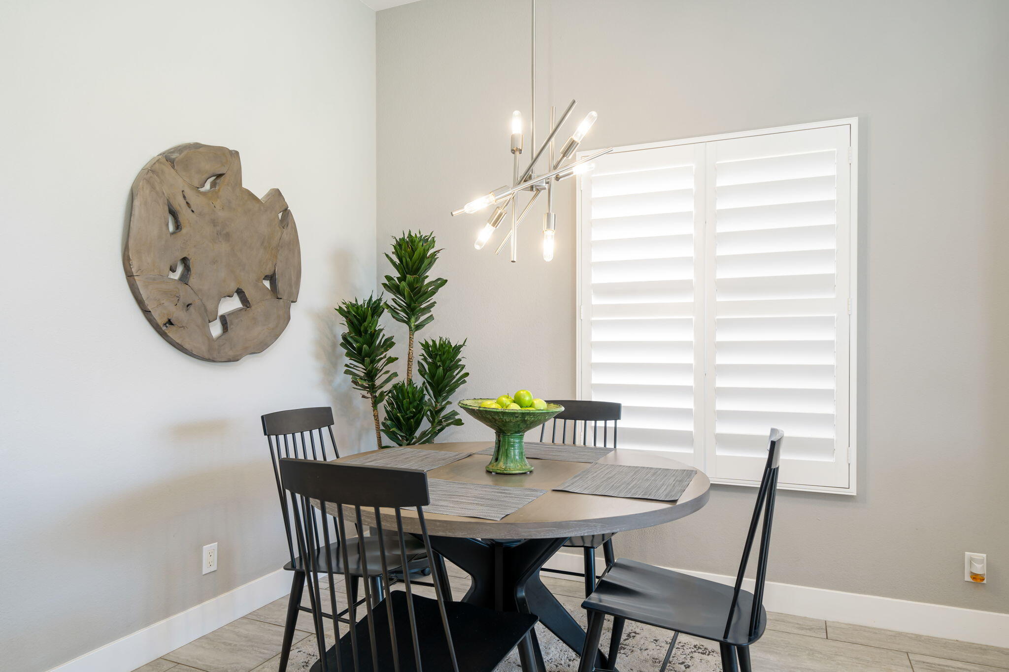 93 Augusta Drive Rancho Mirage, CA 92270 - Photo 17 of 39 a view of a dining room with furniture and chandelier