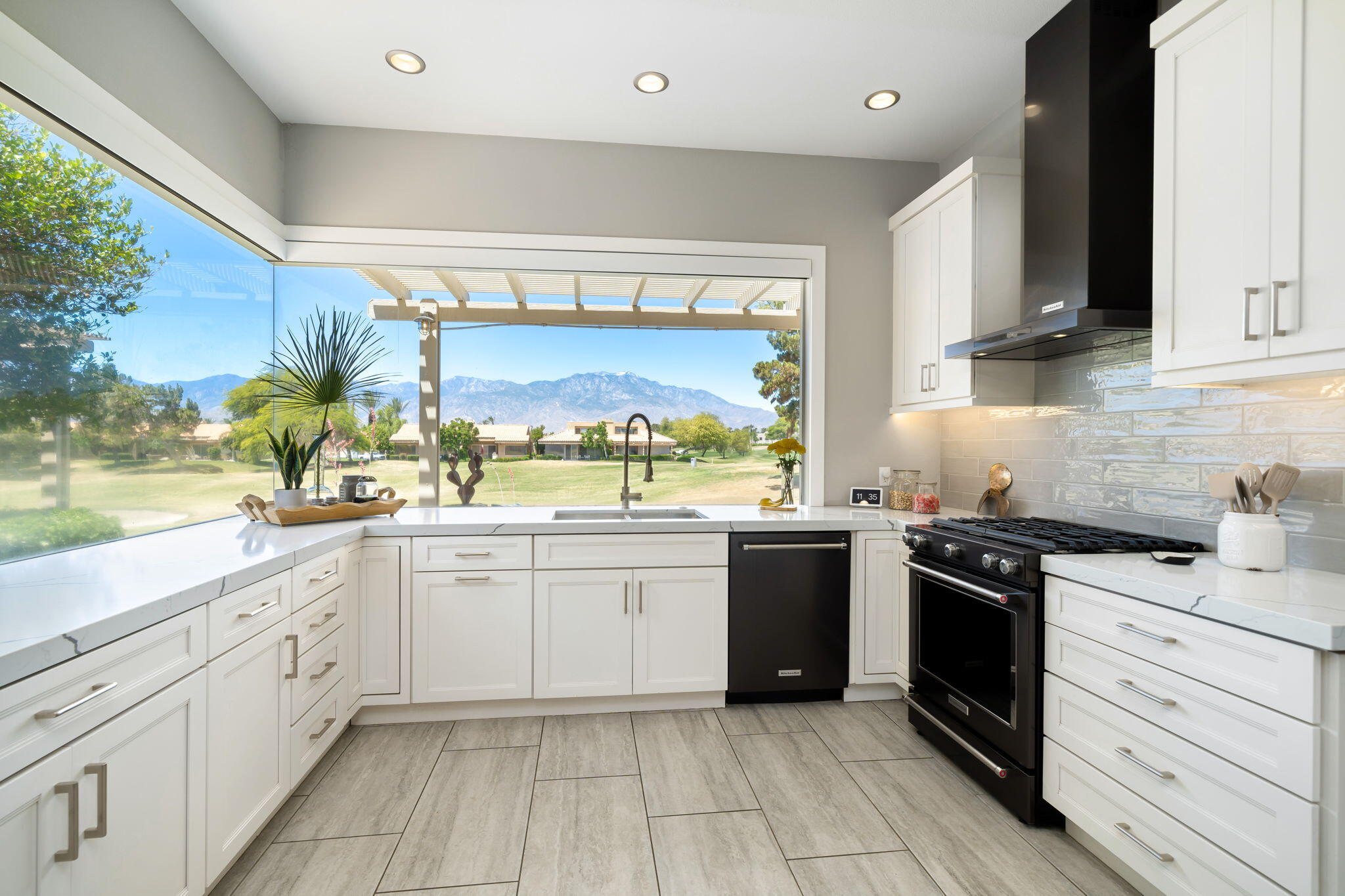 93 Augusta Drive Rancho Mirage, CA 92270 - Photo 19 of 39 a kitchen with stainless steel appliances granite countertop a stove a sink and a refrigerator