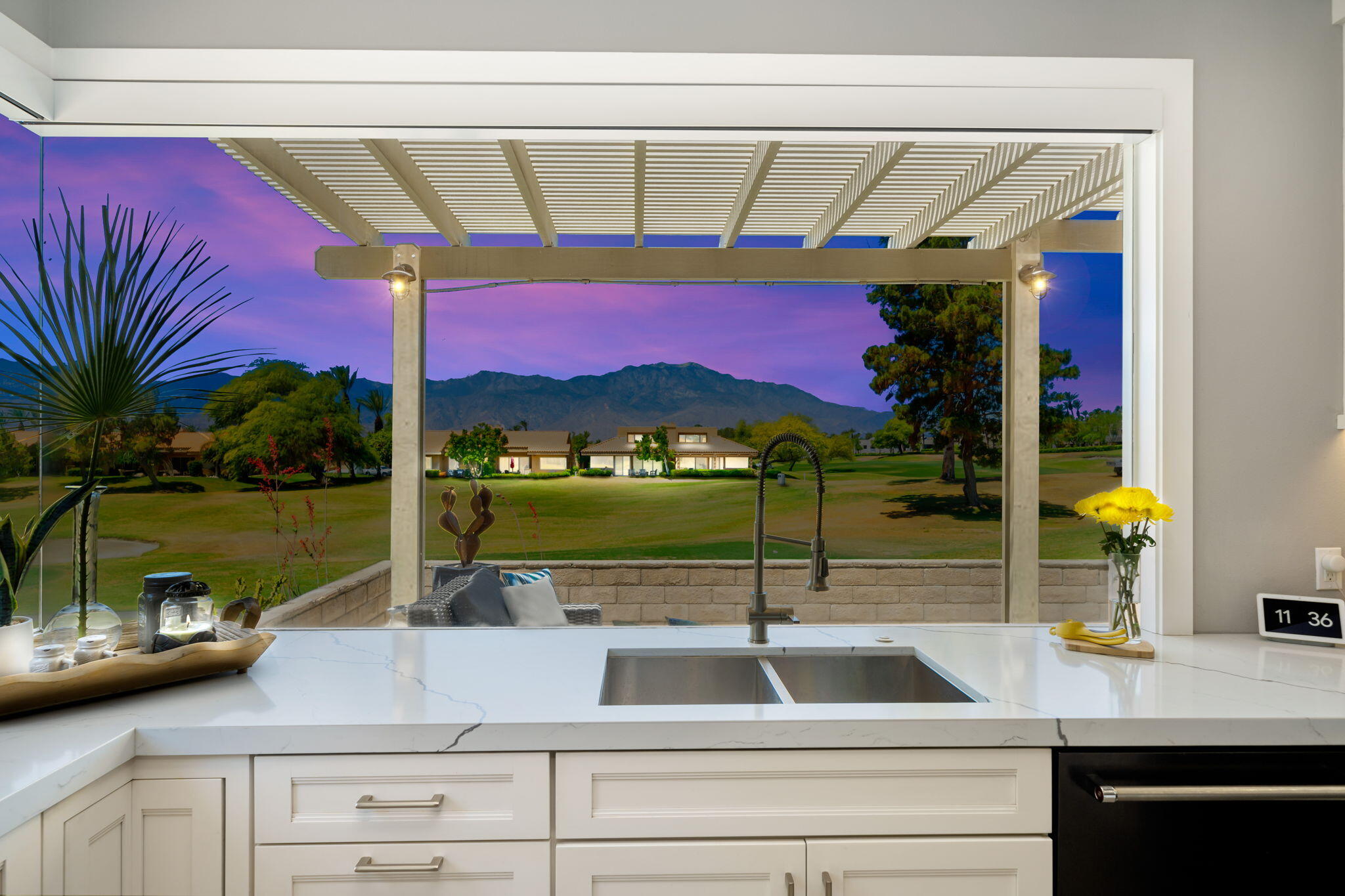 93 Augusta Drive Rancho Mirage, CA 92270 - Photo 20 of 39 a kitchen with a sink and a microwave