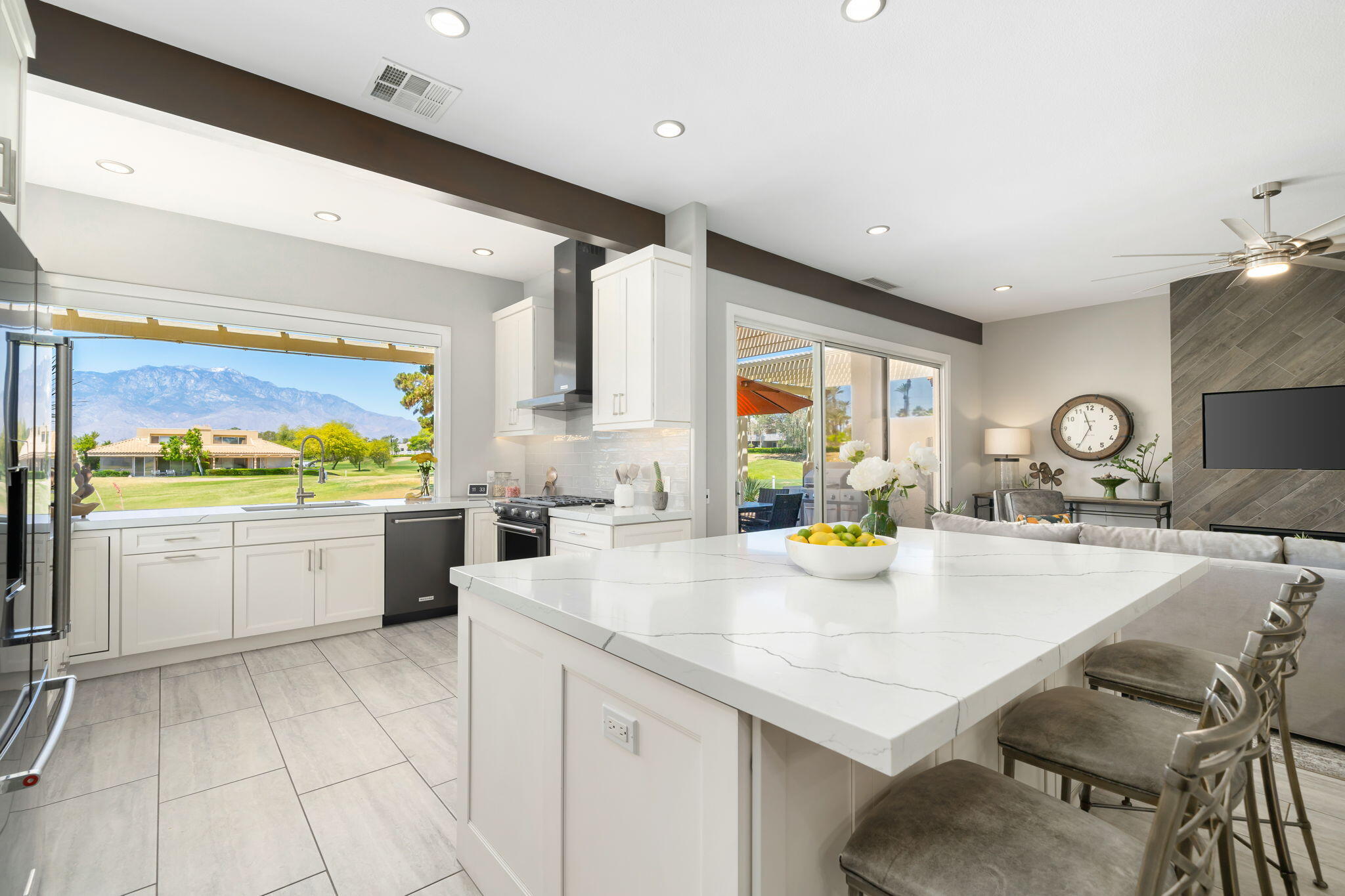 93 Augusta Drive Rancho Mirage, CA 92270 - Photo 2 of 39 a large white kitchen with a large window