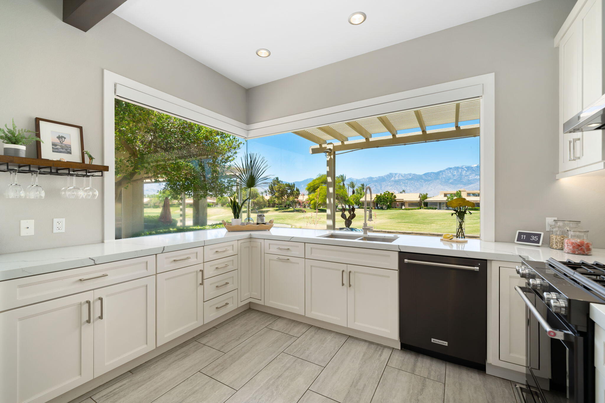 93 Augusta Drive Rancho Mirage, CA 92270 - Photo 21 of 39 a kitchen with sink cabinets and wooden floor