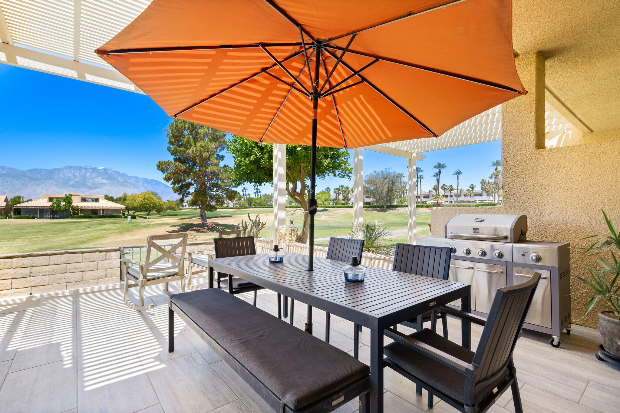 93 Augusta Drive Rancho Mirage, CA 92270 - Photo 22 of 39 a view of an outdoor space with swimming pool and furniture