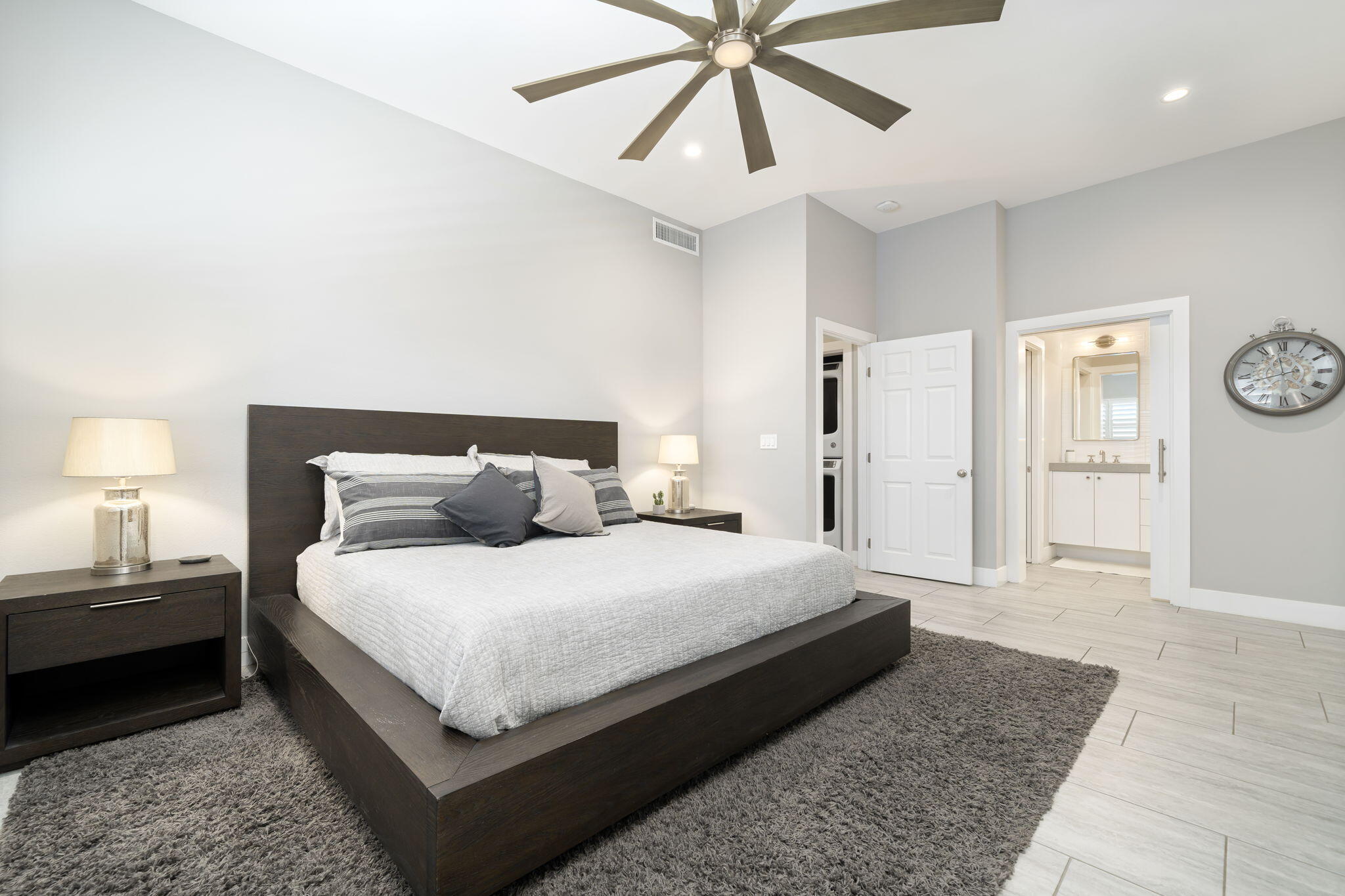 93 Augusta Drive Rancho Mirage, CA 92270 - Photo 27 of 39 a bedroom with a bed and a chandelier