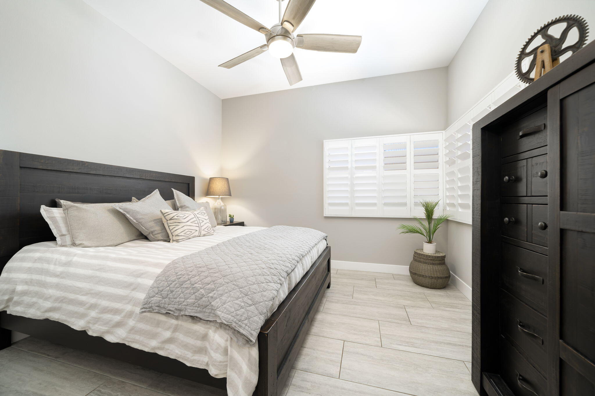93 Augusta Drive Rancho Mirage, CA 92270 - Photo 30 of 39 a bedroom with a bed and a chandelier